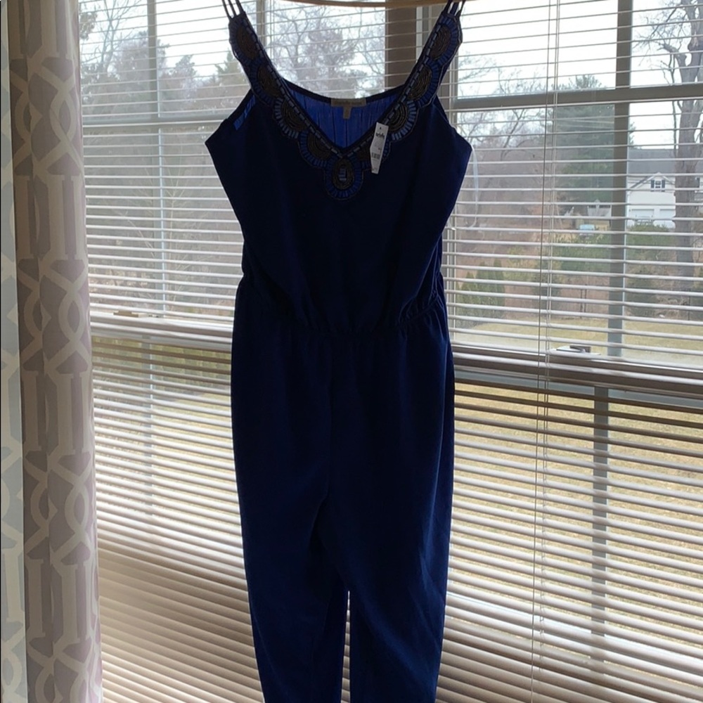 New with tags!! Royal blue jumpsuit.Smoke freehome